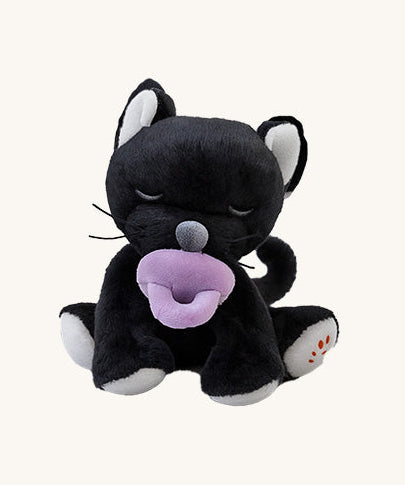 A Olli Ella Kit binky kitten doll sitting with the purple magnetic pacifier in the mouth. This cute fluffy toy doll is available at Babipur
