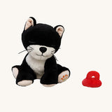 A sitting Olli Ella Kit binky kitten doll available at Babipur. This cute black fluffy kitten doll has light pink paws, whiskers and comes with a red magnetic pacifier.