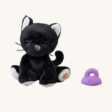 A sitting Olli Ella Koko binky kitten doll available at Babipur. This cute black kitten doll has white paws, whiskers and comes with a purple magnetic pacifier.