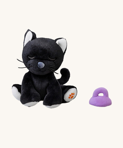 A sitting Olli Ella Koko binky kitten doll available at Babipur. This cute black kitten doll has white paws, whiskers and comes with a purple magnetic pacifier.