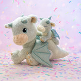 A Olli Ella blaze dinkum dragon doll with a volt dinkum on its back. These two dragons are available at Babipur.