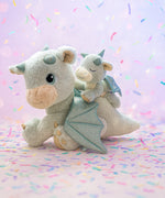 A Olli Ella blaze dinkum dragon doll with a volt dinkum on its back. These two dragons are available at Babipur.