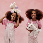 Two children playing with the unicorn toys from Olli Ella