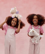 Two children playing with the unicorn toys from Olli Ella