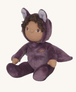 A purple coloured Olli Ella Bowie bat dinky dinkum doll soft toy. The dinky has dark coloured hair and a small embroided rainbow detail on it's chest. These soft toys are part of Olli Ella's Halloween collection available here at Babipur.