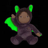 A purple coloured Olli Ella Bowie bat dinky dinkum doll soft toy. The dinky has dark coloured hair and lilac coloured inner wings and ears that glow in the dark. These soft toys are part of Olli Ella's Halloween collection available here at Babipur.