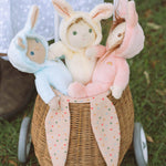 Two children playing with the Olli Ella Dinky Dinkum Dolls Fluffles collection