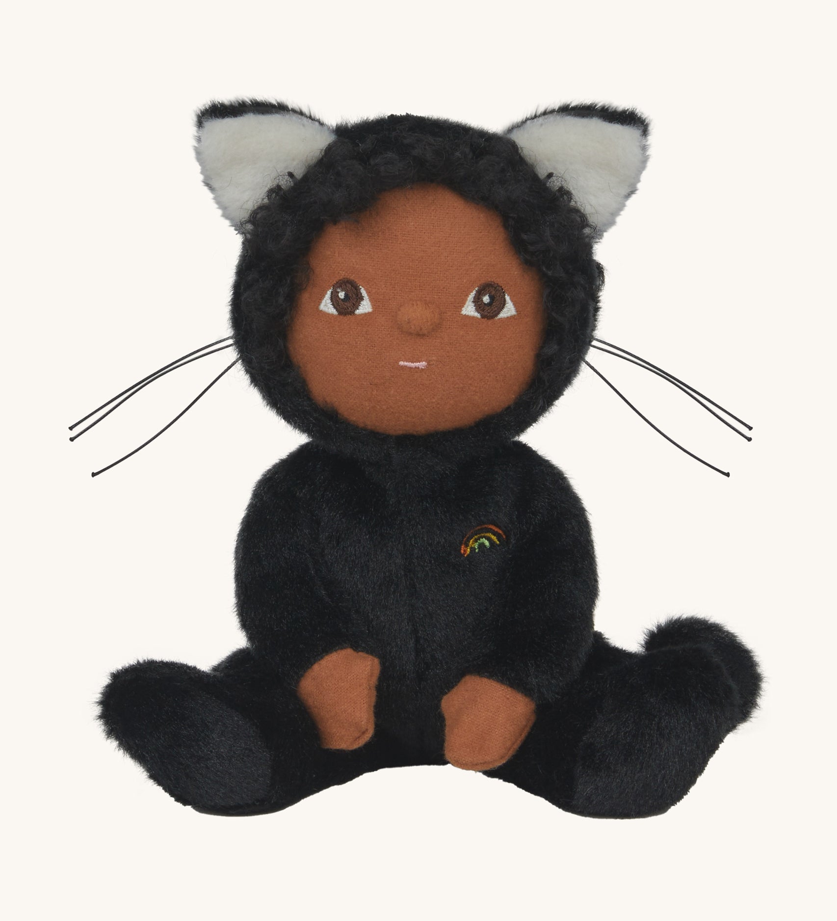 Olli Ella Carson Cat Dinky Dinkum Doll. This soft toy is a black cat with glow in the dark inner ears and a small embroidered rainbow detail on the chest. These soft toys are part of Olli Ella's Halloween collection available here at Babipur.