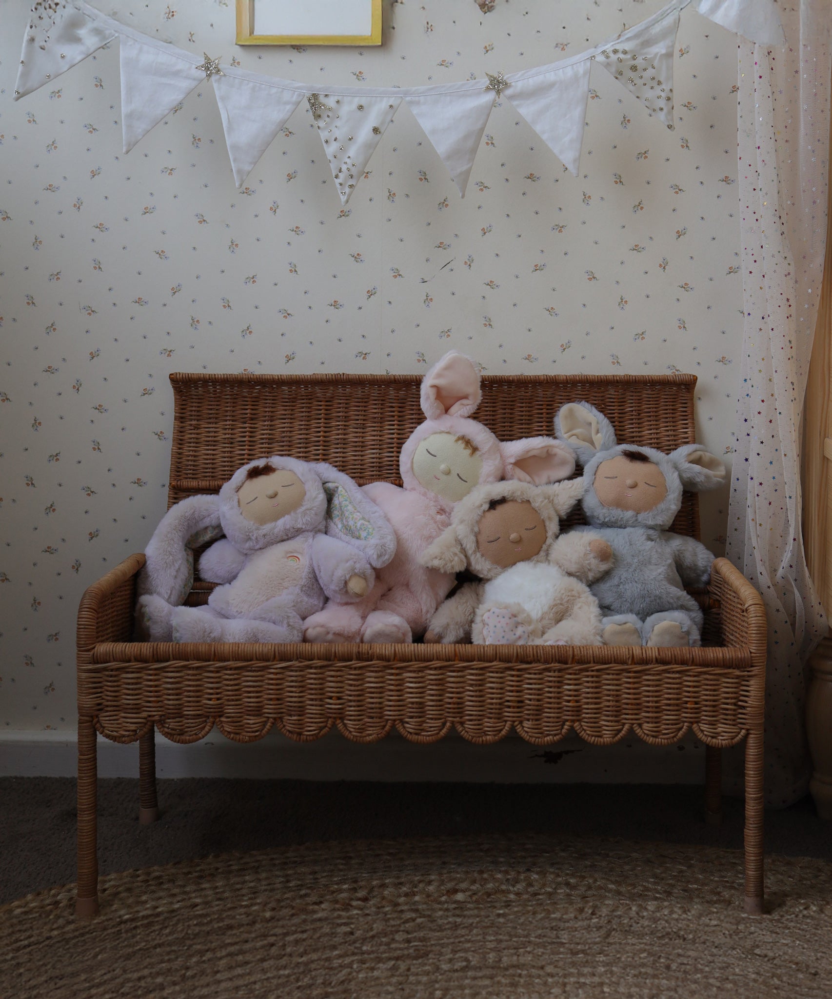 Olli Ella Natural Petal Storie Bench shown with the lid open. There are four Dozy Dinkum bunnies sitting inside. 