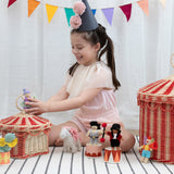 A child playing with the Olli Ella circus holdie folk dolls and the circus basket available at Babipur 