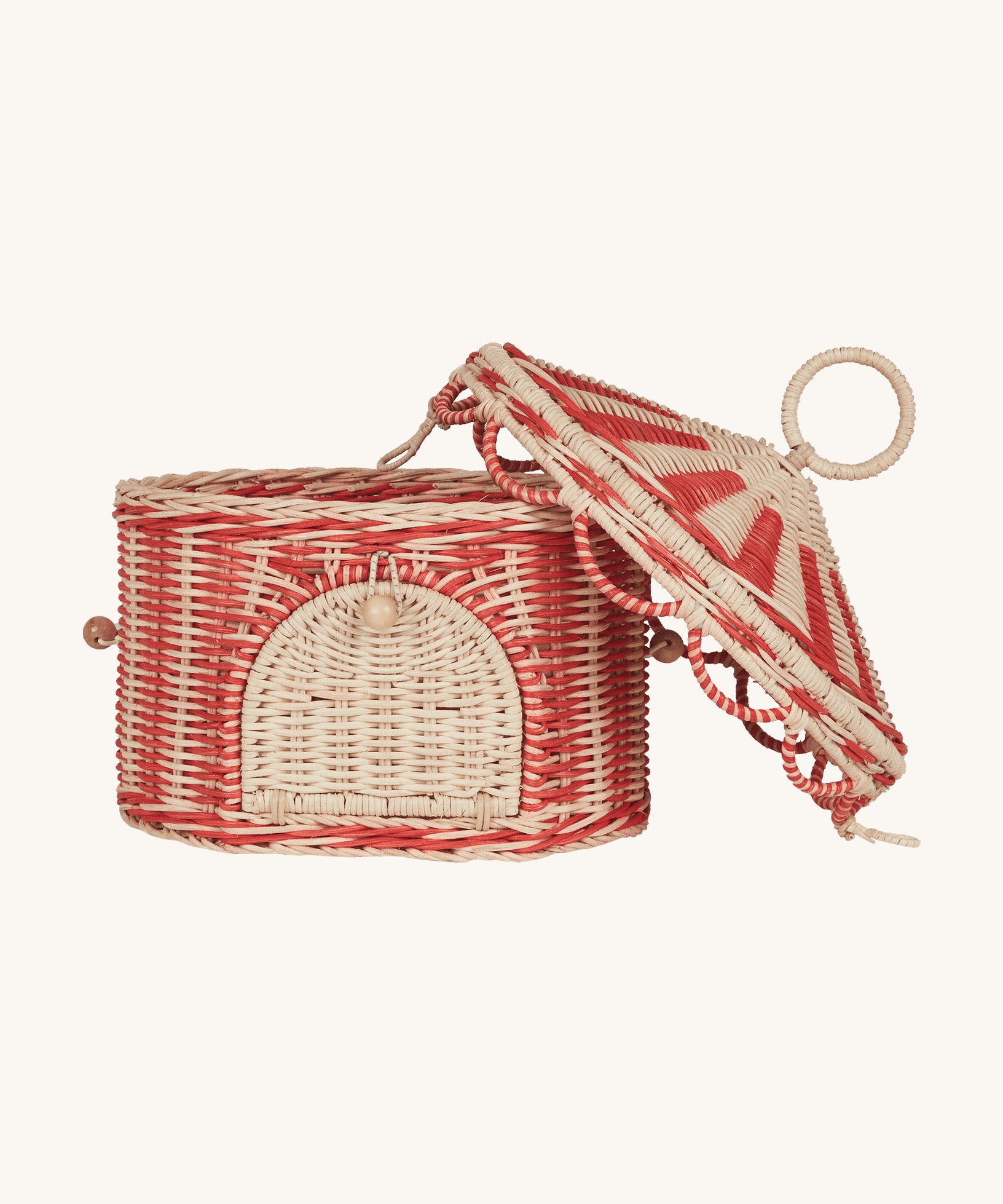 Olli Ella red and white rattan basket in a shape of a circus tent available at Babipur. Features a removable lid and a front door that opens.