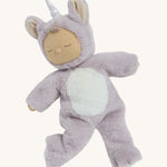 A posing lilac fluffy unicorn Olli Ella dozy dinkum doll on a cream background