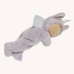 A lilac fluffy unicorn Olli Ella dozy dinkum doll lying down on a cream background