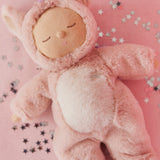A lifestyle photo of the pink Olli Ella unicorn cosy dinkum doll.