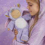 A child holding the Olli Ella Rory cozy dinkum doll 