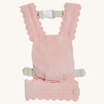 Olli Ella Dinkum Dolls Petal Carrier - Fuschia. A snuggly plush velvet pink doll carrier, on a cream background
