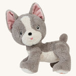 A standing grey and white Gizmo the Olli Ella dinkum dog on a cream background. 