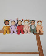 The Olli Ella Backyard Buddies Dinky Dinkum Dolls, all in onesies inspired by garden creatures and bugs, sat on a bench.