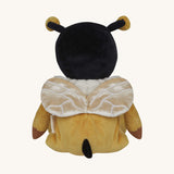 The back of the Olli Ella Dinky Dinkum Doll - Billie Bumblebee - in a yellow onesie with a black hood and antennae and buzzy bee wings.
