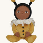 The Olli Ella Dinky Dinkum Doll - Billie Bumblebee - in a yellow onesie with a black hood and antennae, with a white ruffled collar, brown eyes, and buzzy bee wings.