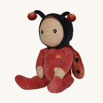 The Olli Ella Dinky Dinkum Doll - Lola Ladybug - in a red onesie with a black hood, brown hair and eyes, spotty ladybird wings, and antennae.