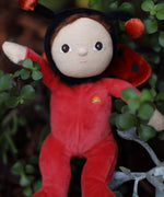 The Olli Ella Dinky Dinkum Doll - Lola Ladybug - in a red onesie with a black hood, brown hair and eyes, spotty ladybird wings, and antennae.