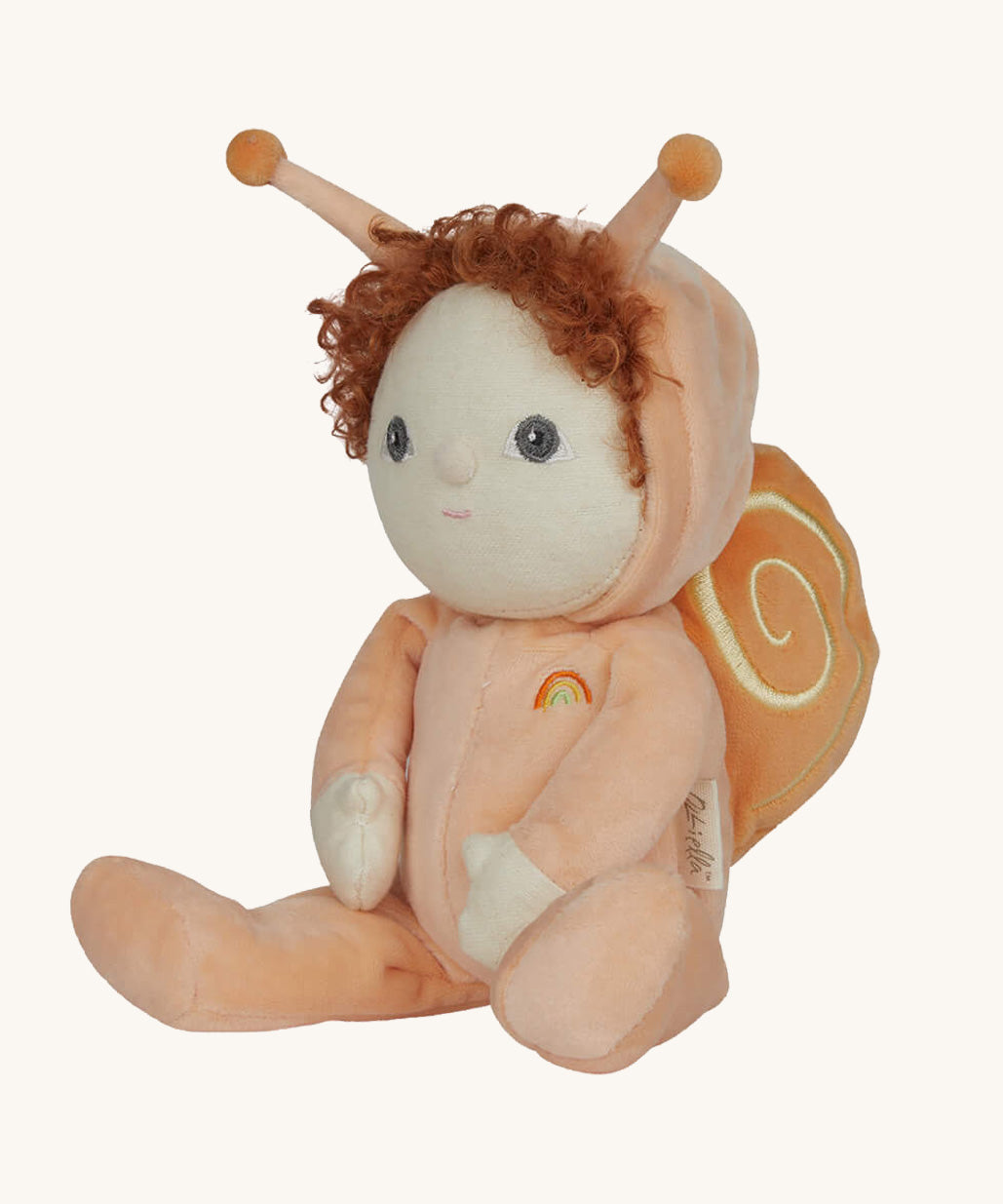 The Olli Ella Dinky Dinkum Doll - Scottie Snail - in a soft light orange onesie with curly red hair, a snail shell on his back, and antennae.