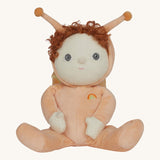 The Olli Ella Dinky Dinkum Doll - Scottie Snail - in a soft light orange onesie with curly red hair, a snail shell on his back, and antennae.