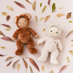 Olli Ella Dinky Dinkum Doll - Fifi Fox. The doll lies on its back next to the Bobby Bear doll surrounded by Autumn leaves.