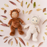 Olli Ella Dinky Dinkum Doll - Fifi Fox. The doll lies on its back next to the Bobby Bear doll surrounded by Autumn leaves.