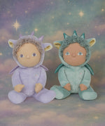 Olli Ella Dante the dragon dinky dinkum doll sitting next to duffy the dragon with a dreamy starry background