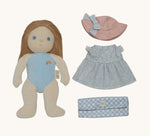 Olli Ella Penelope Petals Dress Me Dinky Dinkum Doll with removable outfit laid out, including blue floral dress, pink hat, and gingham picnic blanket.