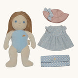 Olli Ella Penelope Petals Dress Me Dinky Dinkum Doll with removable outfit laid out, including blue floral dress, pink hat, and gingham picnic blanket.