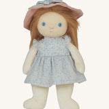 Olli Ella Dress Me Dinky Dinkum Doll Penelope Petals standing in her blue floral dress and pink sunhat with stylable long hair.