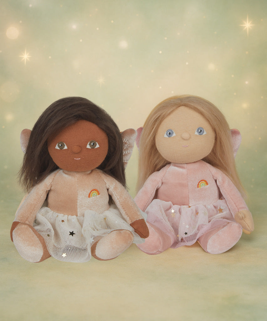 Olli Ella Fiona and Faye fairy dinky dinkum dolls sitting next to each other against a dreamy starry background.