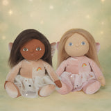 Olli Ella Fiona and Faye fairy dinky dinkum dolls sitting next to each other against a dreamy starry background.