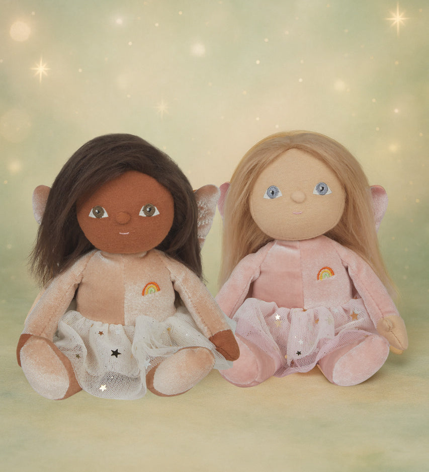 Olli Ella Fiona and Faye fairy dinky dinkum dolls sitting next to each other against a dreamy starry background.