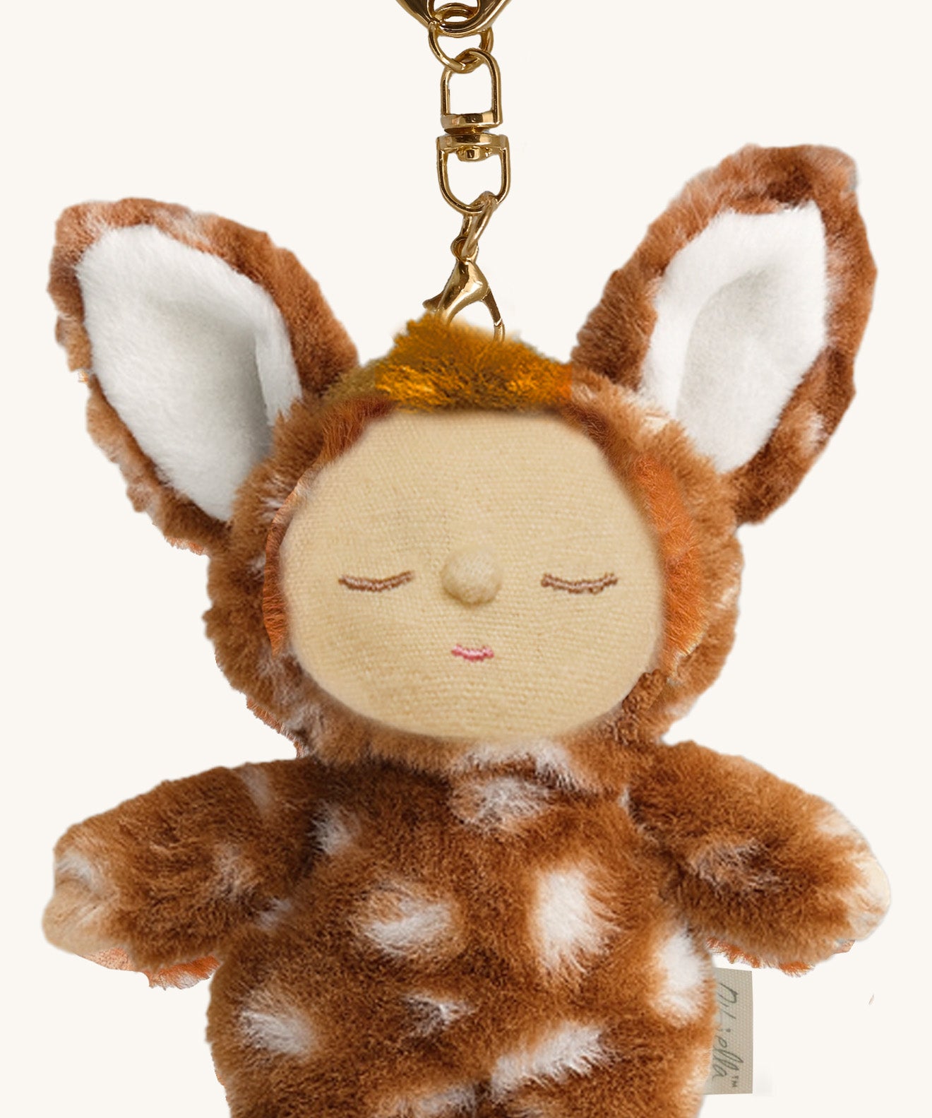 A close up of the Olli Ella fawny lala cozy bag charm available at Babipur showing the cute facial features and clip detail on the charm