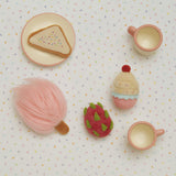 Olli Ella fairy food set on a dotted table cloth A set of 4 soft plush food items including a  cupcake, fairy bread, dragonfruit and candy floss