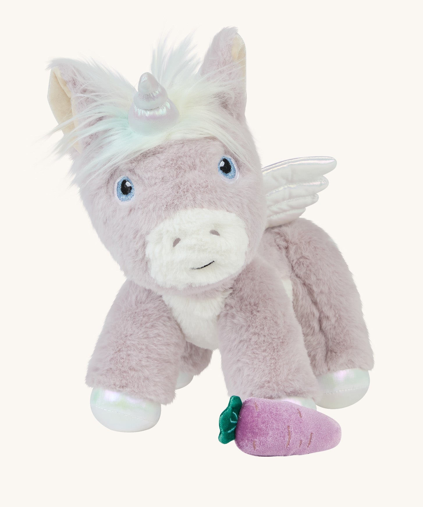 The Olli Ella Glimmer unicorn, which has light purple fur and a white mane with pastel coloured streaks, with a purple carrot at its feet