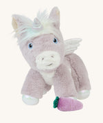 The Olli Ella Glimmer unicorn, which has light purple fur and a white mane with pastel coloured streaks, with a purple carrot at its feet