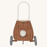 Olli Ella Rattan Bunny Luggy with Lining – Gumdrop and Pansy on a colourful chequed blanket