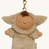 A close up of the Olli Ella lamby pip cozy bag charm available at Babipur showing cute ears and clip attached to charm for clipping on a backpack