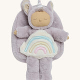 The Olli Ella lilac fluffy backpack with a dozy dinkum doll sitting 