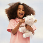 A child play feeding her unicorn toy