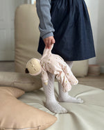 Olli Ella Lullaby Dozy Dinkum Doll - Luna is posed in a sleeping position on a floral blanket.