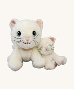 A Olli Ella Lux cat dinkum doll sitting next to Kiki the binky kitten doll with a. Both of these soft toy dolls are available at Babipur.