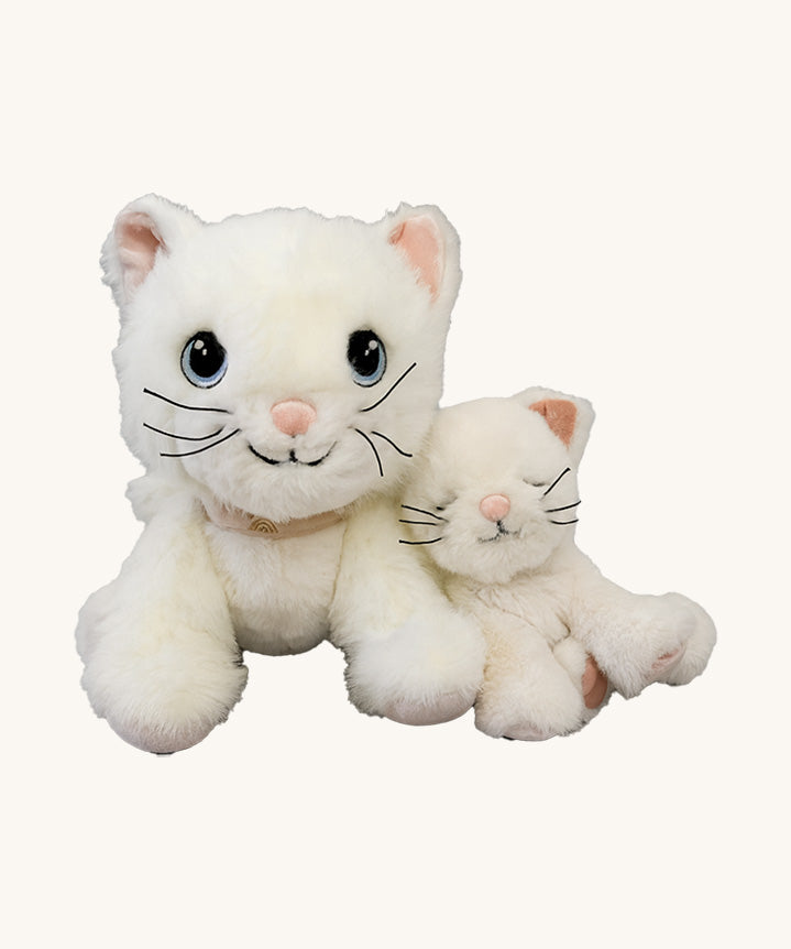 A Olli Ella Lux cat dinkum doll sitting next to Kiki the binky kitten doll with a. Both of these soft toy dolls are available at Babipur.