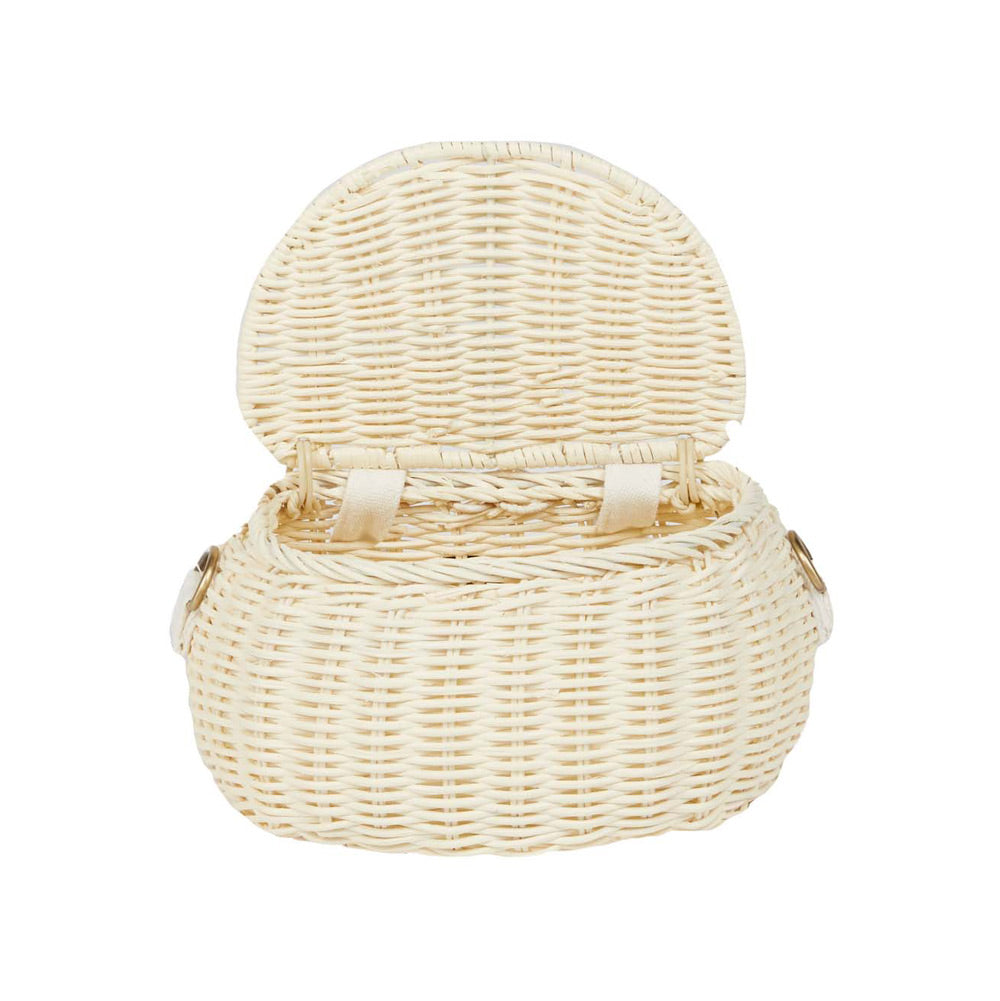 Olli ella natural rattan mini chari bag in the chalk colour with the lid open on a white background