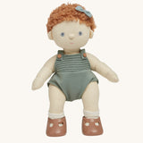 Dinkum Doll standing up pictured on a plain coloured background